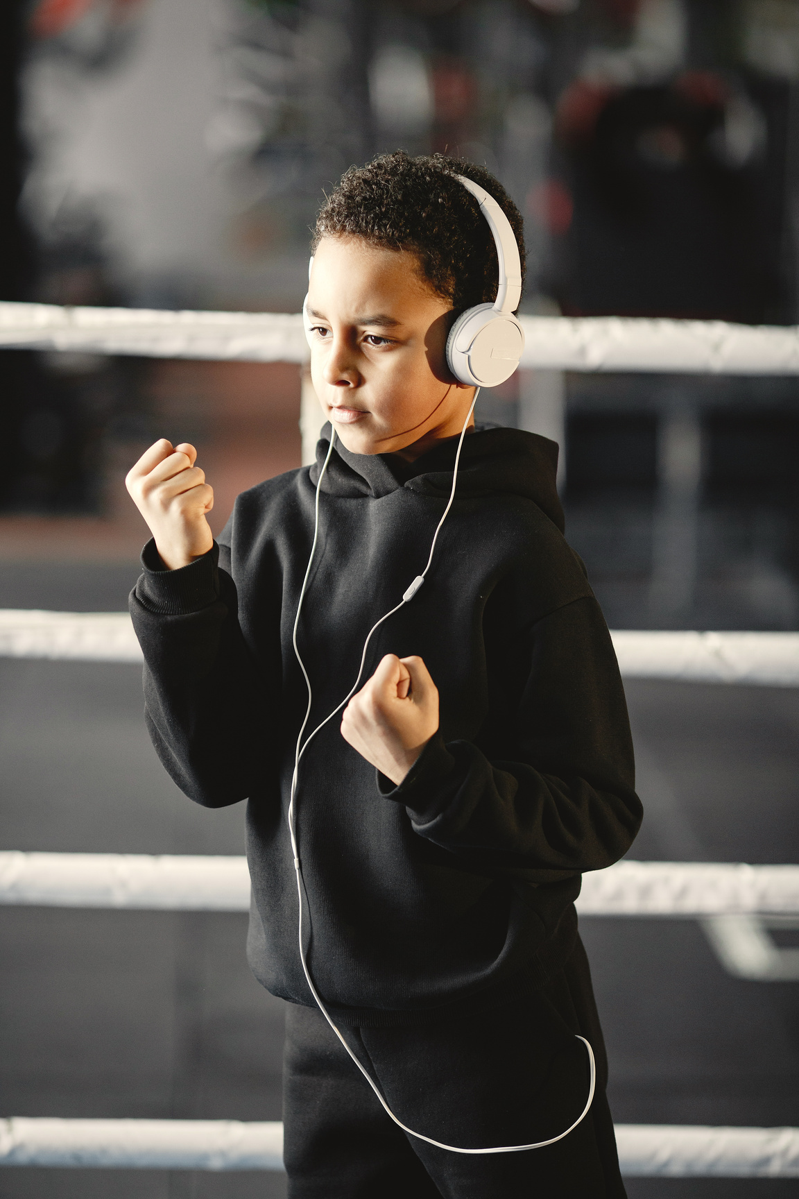 Kid in Black Hoodie Sweater Wearing a Headphones